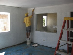 Craig Pfeiffer from NYC priming living room around open portal to kitchen. Craig Pfeiffer from NYC priming living room around open portal to kitchen.